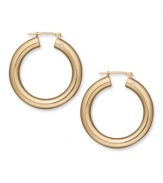 Diamond accents add the dazzle to a traditional pair of hoop earrings. Crafted in 14k gold, by Signature Gold™. Approximate diameter: 1-1/8 inches.