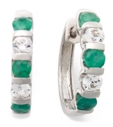 Perfect your look with enviable sparkle. These unique, channel-set hoop earrings feature round-cut emeralds (1-1/4 ct. t.w.) and white sapphires (9/10 ct. t.w.) in sterling silver. Approximate diameter: 21-1/2 mm x 20 mm.