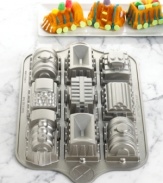 Food is always more fun when it's themed and these train muffins are sure to put your next party right on track! One exceptionally detailed nonstick pan holds nine train molds, from the locomotive to the caboose, so you can build a whole train for an impressive presentation. Lifetime warranty.