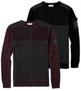 This pieced and color-blocked sweater from DKNY Jeans offers a modern look and a warm cozy feel.