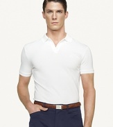 A sleek short-sleeved polo shirt in breathable mercerized stretch cotton piqué is cut for a trim, modern fit that channels timeless preppy athleticism.