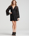 Lace works all the angles from sweet to sophisticated, gracing the chic bell sleeves of the BCBGeneration party dress.