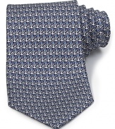 A luxurious piece that lies at the center of your dress wardrobe, this handsome tie from Salvatore Ferragamo is crafted in 100% Italian silk.