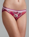 A floral print in rich autumn colors decorate a stretchy bikini from Calvin Klein.