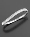 This beautiful diamond bracelet features a unique swirled shape with an exquisite combination of round-cut and baguette-cut diamonds (2 ct. t.w.) set in 14k white gold.