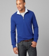 Perfect for a relaxing night out, this half-zip Tommy Hilfiger shirt adds suave style to any outfit.