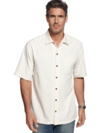 Luxurious silk upgrades this casual classic shirt with floral print and parrot embroidery from Tommy Bahama.