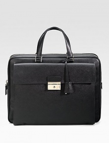 An elegant briefcase in textured saffiano leather with a large envelope exterior pocket. Zip closure Top handles Exterior pocket with clasp closure Interior zip pocket 15¾W X 12H X 2¼D Made in Italy 