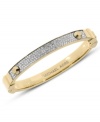 Golden style that begs to be stacked. This hinge bracelet by Michael Kors embellishes a classic bangle with pave-set glass accents. Crafted in gold tone mixed metal. Approximate diameter: 2-1/4 inches.