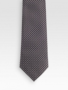 Patterned tie woven in fine Italian silk.About 3.1 wideSilkDry cleanMade in Italy