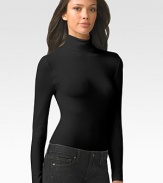 Smooth, opaque mix of Austrian cotton and nylon is finished with a cozy turtleneck that's perfect for layering. Pullover style Cotton/nylon/elastene Machine wash or dry clean Made in Austria