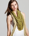 This Eileen Fisher diamond-cut wrap scarf brings on-trend color and effortless style to your weekend looks.