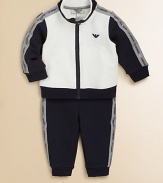 A cozy, zip-front jacket with logo tape detailing tops a pair of matching track pants for sporty style. Jacket Stand collarLong sleevesZip-frontRibbed hem and cuffs Pants Elastic waistbandRibbed hem92% cotton/8% elastaneDry cleanImported