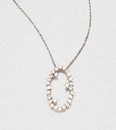 Sparkling white sapphires set in 14k white gold with a open oval design on a delicate link chain. White sapphire14k white goldLength, about 16Pendant size, about .6 Spring ring closureMade in USA