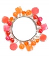 Ride the vintage vibe in this retro-inspired style. Haskell's chic, candy-colored bracelet features orange and fuchsia shaky beads in a variety of shapes and sizes. Set in silver tone mixed metal. Bracelet stretches to fit wrist. Approximate diameter: 2-1/2 inches.