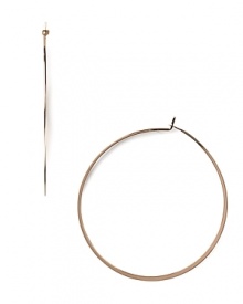 A striking yet slim silhouette makes these classic hoop earrings feminine and refined. From MICHAEL Michael Kors.