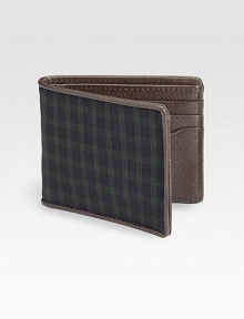 Made from the classic blackwatch tartan, the colors of a historic Scottish force, this bill holder is edged with boarskin embossed leather for a signature feel.One billfold compartmentSix cards slotsCotton/leather4W x 4HImported