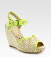 Textured raffia with a wooden wedge, an adjustable slingback strap and smooth, contrasting leather trim. Wooden wedge, 4 (100mm)Wooden platform, ¾ (20mm)Compares to a 3¼ heel (80mm)Raffia upperLeather lining and solePadded insoleImportedOUR FIT MODEL RECOMMENDS ordering true size. 