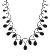 Onyx gets the teardrop treatment to glamorous effect. Genevieve & Grace's necklace, set in sterling silver, also features marcasite to enhance the appeal. Approximate length: 17 inches. Approximate drop: 1-3/8 inches.