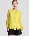 Pintucks and ruffles lend ladylike charm to this pop-bright DIANE von FURSTENBERG top, articulated in supple silk.