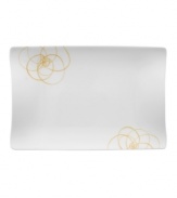 A modern canvas for everyday meals, the large Bloom Sun rectangular plates have a smooth, flat surface that's artfully scribbled with golden florals for a look that's fresh--and in durable porcelain--not fussy. From Villeroy & Boch.