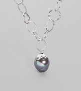 An open link chain of hammered sterling silver is highlighted by an iridiscent organic grey pearl drop. 22mm man-made pearl Sterling silver Length, about 17 Lobster clasp with charm detail Made in Spain