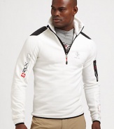 Constructed in a breathable stretch fleece, a half-zip mockneck jacket makes a sporty statement with woven patches and printed logo graphics.Half-zip frontStand collarZippered pocket at sleeve53% polyester/38% nylon/9% elastaneMachine washImported