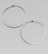 Make a quiet statement in these elegant hoop earrings. Silvertone metalLength, about 2.25Post closureImported 