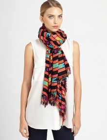 Wearable art takes a new form on this lightweight scarf adorned with a vibrant, tribal-inspired print and allover fringe trim.Viscose44 X 78Hand washImported