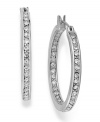 Expertly crafted by Swarovski, these darling hoop earrings are adorned with small and delicate crystals. Crafted in stainless steel. Approximate diameter: 1 inch.