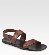 Signature gancini stamped leather shapes this casual slip-on with back buckle strap.Calfskin upperLeather liningPadded insoleRubber soleMade in Italy