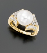 This bold style radiates elegant luxury. A gleaming, cultured freshwater pearl (10 mm) is surrounded by the sparkle of round-cut diamonds (1/16 ct. t.w.). Set in 14k gold.