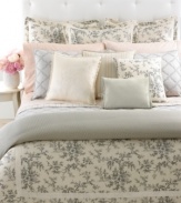 A detailed toile print of cherry blossoms and branches cascades over a sumptuous cream ground in the Saint Honore sham. Streamlined piping and ribbon accents finish this traditional look with a touch of modern romance.