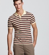 With a vibrant punch of multicolored stripes, this classic polo from Lacoste gets a stylish-yet-edgy update.