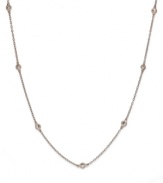 Inch by inch of luminous sparkle. B. Brilliant's delicate necklace features eleven round-cut cubic zirconia stations (1-1/10 ct. t.w.) set in 18k gold over sterling silver. Approximate length: 36 inches.