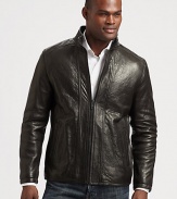 Make a statement without saying a word in this exquisite leather jacket treated perfectly to exude a look that is both rugged and refined.Zip frontStand collarSide slash pocketsAbout 28 from shoulder to hemLeatherDry cleanImported