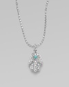 The open hand, a traditional symbol of protection, set with pavé diamonds and a vibrant turquoise center on a 14k white gold ball chain.Diamonds, 0.06 tcw 14k yellow gold Chain length, about 16 Pendant length, about ½ Lobster clasp Imported