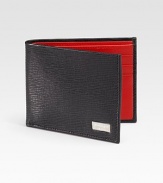 A slim-line design handsomely crafted in Italy from embossed calfskin leather.One bill compartmentSix card slots4¼ x 3½Made in Italy