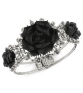 Black and beautiful. This bangle bracelet from 2028, crafted from silver-tone mixed metal, features glass stones and jet-colored flower details for a stunning effect. Approximate diameter: 6-1/2 inches.