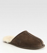 Warm, comfortable suede slip-ons are fully lined in sheepskin with a sheepskin sockliner that naturally wicks away moisture and helps keep feet dry. Lightweight sueded rubber outsole with embossed logo Imported