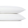 Effortless elegance. A creamy hue and high thread count distinguish these luxurious Donna Karan pillowcases.