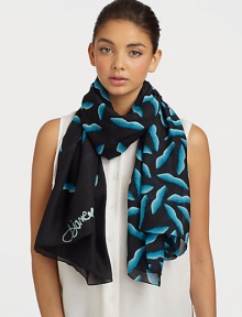 A smooth silk style that features a graphic, abstract lip print. SilkAbout 40 X 67Dry cleanImported 