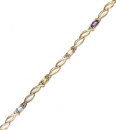 All the colors of the rainbow. Victoria Townsend's oval link bracelet features oval-cut amethyst (1/2 ct. t.w.), blue topaz (1/4 ct. t.w.), citrine (1/5 ct. t.w.), garnet (1/2 ct. t.w.), peridot (1/4 ct. t.w.) and diamond accents. Set in 18k gold over sterling silver. Approximate length: 7-1/4 inches.