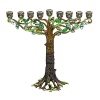 A creatively luxe essential for celebrating the holidays, this tree-inspired menorah glitters with dozens of hand-set Swarovski® crystals and glass gems set in hand-enameled cast pewter with an antique brash finish.