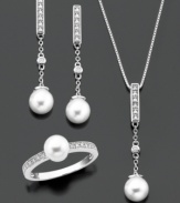 A complete jewelry set with unmeasurable elegance. Pendant, ring and earrings feature round-cut diamond (1/5 ct. t.w.) and cultured freshwater pearl set in sterling silver. Pendant measures approximately 18 inches with a 1-1/4-inch drop. Earrings measure approximately 1-1/4 inches. Ring size 7.