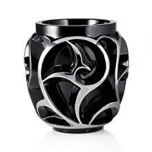 In 1926, at the peak of his art, Rene Lalique created the Tourbillons vase. The eye is mystified by the rich interlaced pattern of crystal. Graphic, geometric and poetic all at once, its surprising architecture invites the onlooker to lose himself in a swirl of crystal and light. The careful hand-painted platinum enameling requires several hours of dedicated work and reveals the depth of the design. Rare and precious, platinum brings true nobility to the Tourbillons vase and emphasizes its volutes.