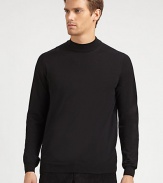 A sophisticated layer with a ribbed mockneck collar in soft merino wool.Ribbed mockneck collarLong sleeves with ribbed cuffsRibbed hemMerino woolDry cleanImported