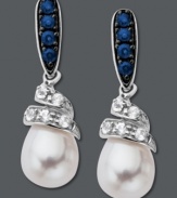 Dabble in a fresh, new design. These swirling drop earrings feature round-cut blue sapphires at the post (1/4 ct. t.w.) and round-cut white sapphires (1/5 ct. t.w) that cradle a shimmering cultured freshwater pearl (7 mm x 9 mm). Crafted in sterling silver. Approximate drop: 9/10 inch.