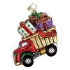 A toy dump truck hauls beautifully wrapped presents in this glass holiday ornament.