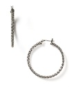 Classic hoop earrings from LAUREN by Ralph Lauren with a textured, braided curve and worn silvertone hue.